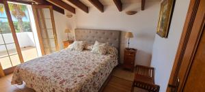 A bed or beds in a room at Son Set Villa