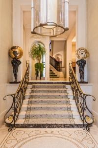 a row of stairs leading up to a balcony at Hôtel San Régis in Paris