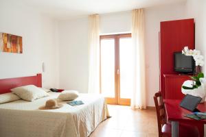 Voodi või voodid majutusasutuse Hotel Delle More toas