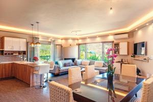 a living room with a couch and a table at Villa giannis in Vitalades