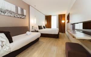 Un ou plusieurs lits dans un hébergement de l'établissement Grums Hotel & Spa