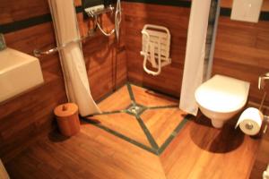 a bathroom with a shower and a toilet and a sink at Le Magasin à Sel in Crozon