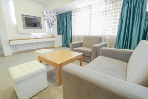 TV a/nebo společenská místnost v ubytování Gardenia Hotel & Spa