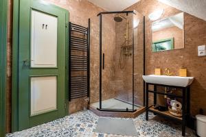 a bathroom with a glass shower and a sink at Penzion Betlém in Hlinsko +36 photos