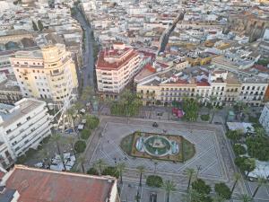 an aerial view of a city with a building at Los Corceles Casa Palacio in Jerez de la Frontera +90 photos