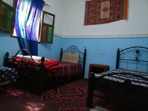 Giường trong phòng chung tại Gîte Tamsoulte