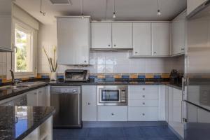 Kuchyň nebo kuchyňský kout v ubytování Apartamento Brisa de mar