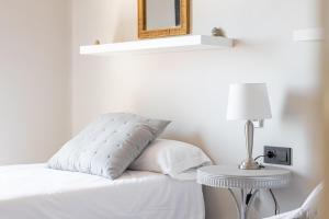 A bed or beds in a room at La Reserva