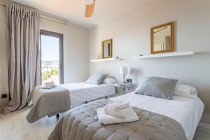 A bed or beds in a room at La Reserva