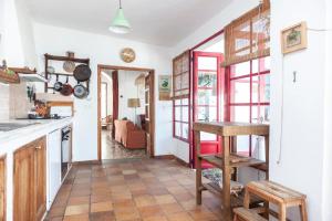 a kitchen with a table and a counter top at La casona de Aguafría in Aguafría