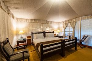 מיטה או מיטות בחדר ב-Jungle Cave Resort