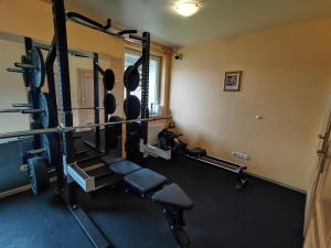 a room with a gym with several tread machines at Hotelik Dworek Legnickie Pole 4km od Legnicy in Legnickie Pole