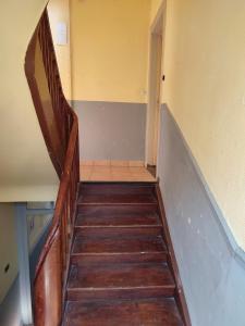 a staircase in a building with a wooden stair case at *** les loges de la friche DMC *** in Mulhouse