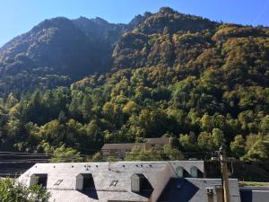 a mountain with a building in front of it at Le Clos des Marmottes in Cauterets