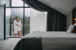 Postel nebo postele na pokoji v ubytování Green Mountain 5* Hotel
