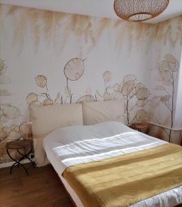 a bedroom with a bed with clocks on the wall at Auberge Buissonniere in Gresse-en-Vercors