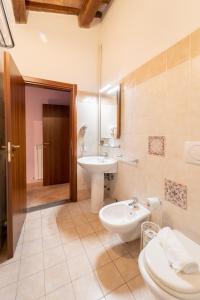 a bathroom with a sink and a toilet and a sink at Albergo La Loggia di San Martino in Gualdo Tadino +64 photos