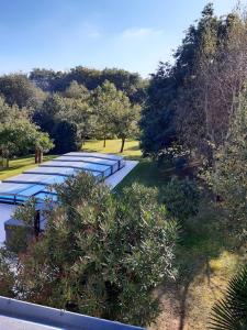 an overhead view of a row of blue umbrellas at chambre d'hôtes Les Hortensias in Saint-Jean-la-Poterie