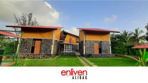 纳加奥恩Enliven Homestay Alibag, Alibaug的一张房子的照片,上面写着字母