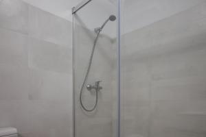 a shower in a bathroom with a glass door at Cascais Center Apartment - 500 m from the beach in Cascais
