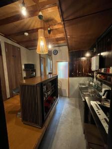 a kitchen with a island in the middle of it at Kikunoya - Vacation STAY 83152 in Nagoya