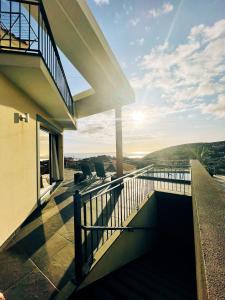 a balcony of a house with a view at Vila Juntos by Your Madeira Rentals in Ponta do Sol