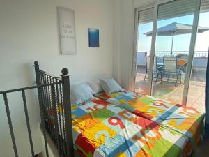 A bed or beds in a room at Amazing duplex with large terrace and sea views Még 37 kép
