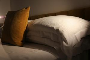 a close up of a pillow on a bed at Old Town Home Trastevere in Rome