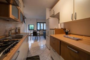 a kitchen with a sink and a counter top at FISHERMAN in Pisogne