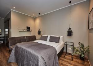 Postel nebo postele na pokoji v ubytování Keflavik Micro Suites