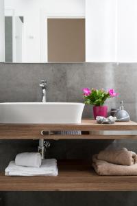 a bathroom with a sink and a mirror at L'isola che c'è in Cagliari +77 photos