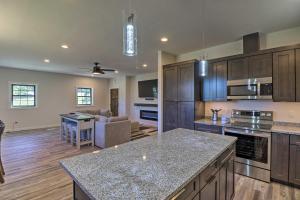 a large kitchen with a large island in a room at Modern Kalispell Retreat 37 Mi to Glacier NP in Kalispell
