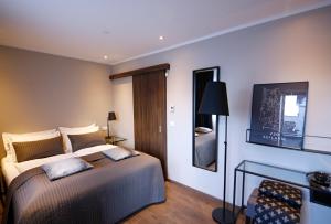 Postel nebo postele na pokoji v ubytování Keflavik Micro Suites
