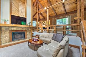 a living room with a couch and a fireplace at Vintage Massanutten Resort Villa with Deck! in McGaheysville