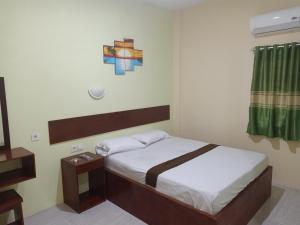 Cama o camas de una habitación en Wisma Cemara Dumai