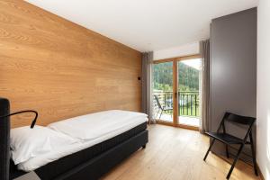 Łóżko lub łóżka w pokoju w obiekcie Residence Catarina Lanz