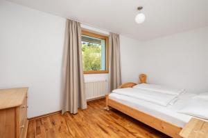 Łóżko lub łóżka w pokoju w obiekcie Residence Catarina Lanz