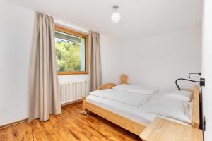 Łóżko lub łóżka w pokoju w obiekcie Residence Catarina Lanz