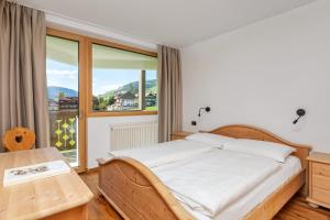 Łóżko lub łóżka w pokoju w obiekcie Residence Catarina Lanz