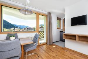 Telewizja i/lub zestaw kina domowego w obiekcie Residence Catarina Lanz