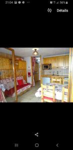 Postel nebo postele na pokoji v ubytování Appartement au cœur du domaine du grand massif