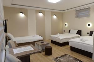 Llit o llits en una habitació de Kovač Residence