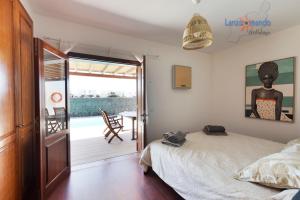Łóżko lub łóżka w pokoju w obiekcie Vivienda Vacacional Del Mar