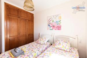 Łóżko lub łóżka w pokoju w obiekcie Vivienda Vacacional Del Mar