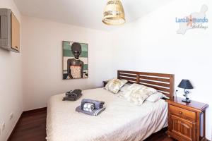 Łóżko lub łóżka w pokoju w obiekcie Vivienda Vacacional Del Mar
