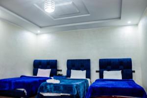 Voodi või voodid majutusasutuse HOTEL BORJ EL ARAB toas