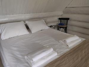 A bed or beds in a room at Сказочный дом в 20 мин от Горнолыжки