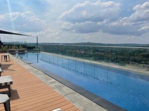 a large swimming pool on top of a building at Menlyn Maine Trilogy Hotel in Pretoria