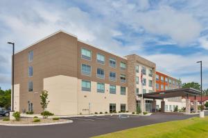 an image of the front of a hotel at Holiday Inn Express & Suites - Milan - Sandusky Area, an IHG Hotel in Milan