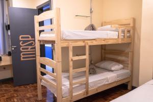 Postel nebo postele na pokoji v ubytování HOSTEL CUARTO